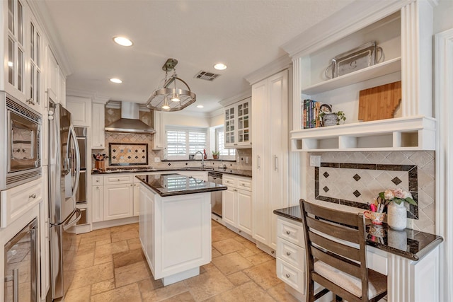 kitchen with wall chimney range hood, visible vents, appliances with stainless steel finishes, open shelves, and wine cooler
