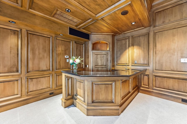 office featuring wood walls, beam ceiling, coffered ceiling, wooden ceiling, and carpet