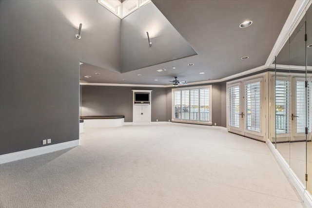 unfurnished living room featuring recessed lighting, baseboards, ornamental molding, and a ceiling fan