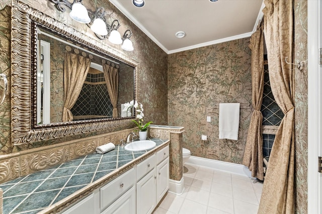 bathroom with vanity, ornamental molding, tile patterned flooring, toilet, and wallpapered walls