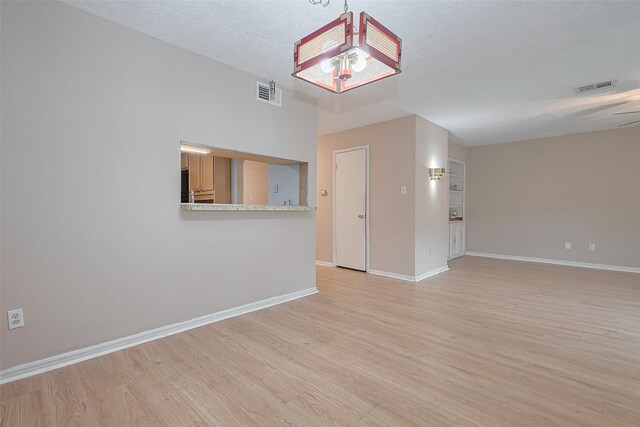 772 Thicket Ln, Houston, TX 77079 - spare room featuring visible vents, light wood finished floors, and baseboards