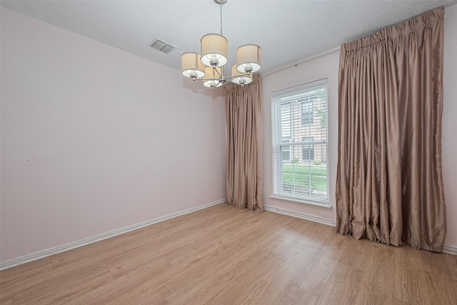 772 Thicket Ln, Houston, TX 77079 - empty room with baseboards, a notable chandelier, light wood finished floors, and visible vents