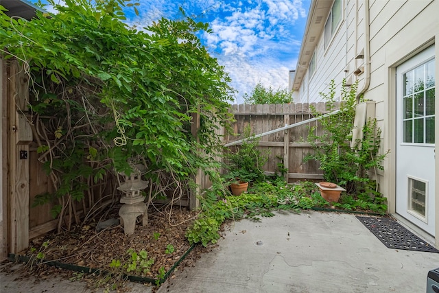 view of patio / terrace featuring fence