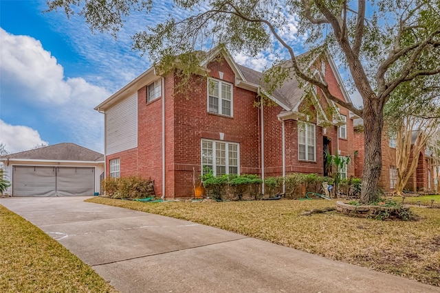 view of front of property featuring brick siding, a front lawn, and a garage