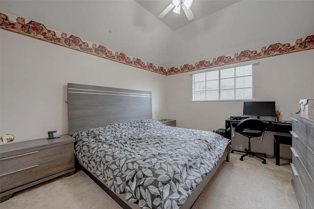 bedroom with light colored carpet, a ceiling fan, and a desk