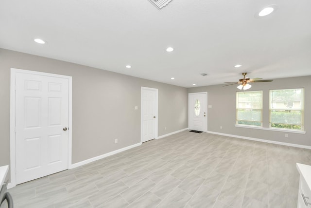 unfurnished living room with recessed lighting, baseboards, ceiling fan, and visible vents