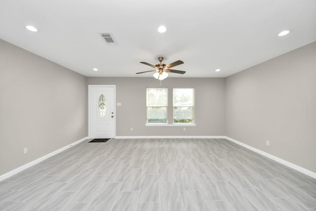 unfurnished living room featuring recessed lighting, ceiling fan, visible vents, and baseboards