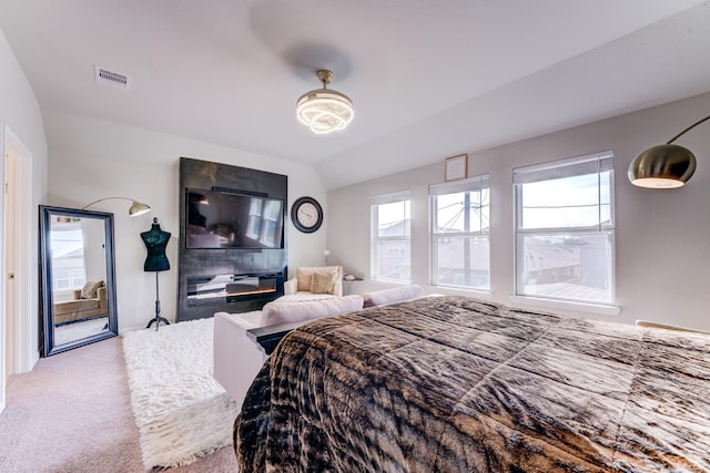 529 N 6th St, La Porte, TX 77571 - bedroom featuring visible vents, carpet flooring, and vaulted ceiling