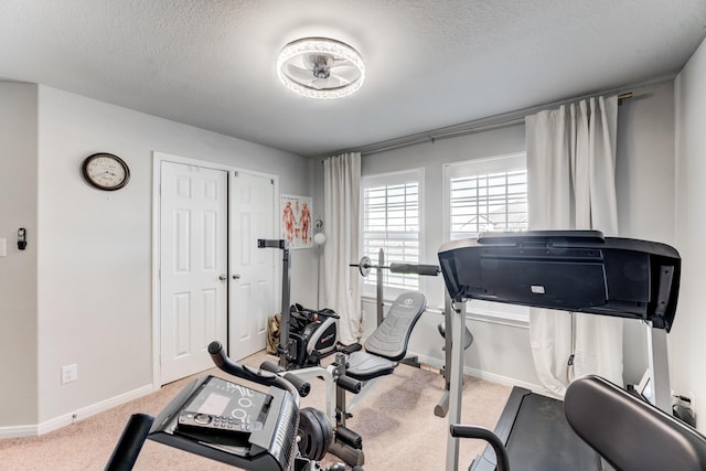 529 N 6th St, La Porte, TX 77571 - exercise area with carpet floors, a textured ceiling, and baseboards