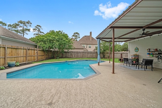 view of pool with a fenced in pool, a fenced backyard, and a patio area