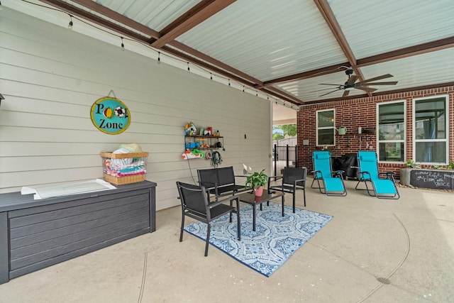 view of patio featuring a ceiling fan, outdoor lounge area, and fence