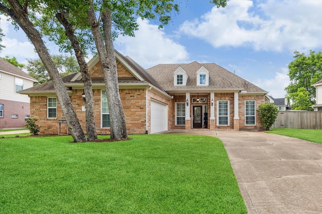 1519 Brookstone Ln, Sugar Land, TX 77479 - view of front of home with brick siding, a garage, driveway, and a shingled roof