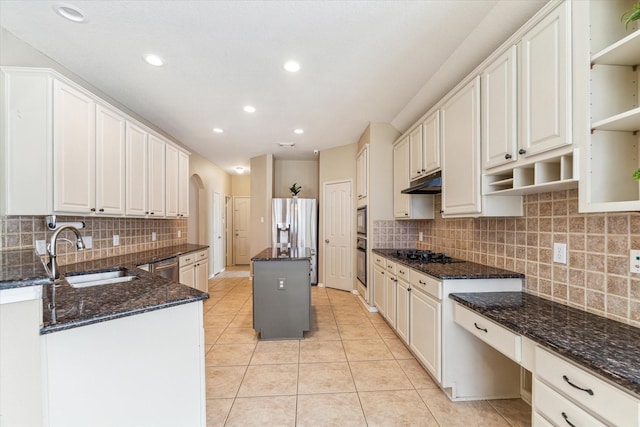 1519 Brookstone Ln, Sugar Land, TX 77479 - kitchen with a sink, open shelves, black appliances, arched walkways, and light tile patterned floors