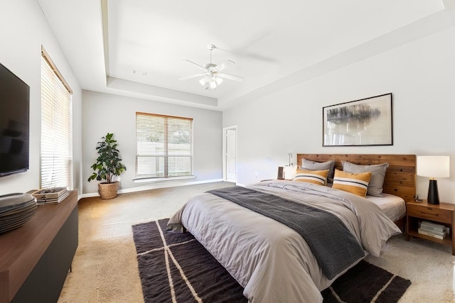 1519 Brookstone Ln, Sugar Land, TX 77479 - carpeted bedroom featuring a raised ceiling, baseboards, and a ceiling fan
