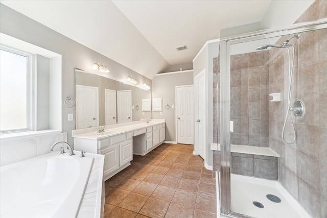 1519 Brookstone Ln, Sugar Land, TX 77479 - bathroom with lofted ceiling, a shower stall, double vanity, a bath, and tile patterned flooring
