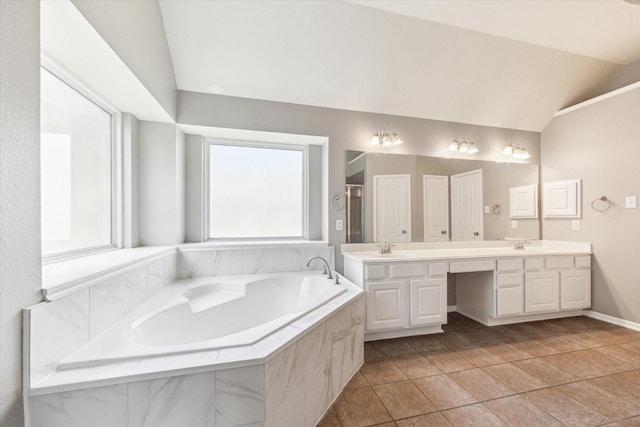 1519 Brookstone Ln, Sugar Land, TX 77479 - bathroom featuring lofted ceiling, a garden tub, double vanity, and a shower stall