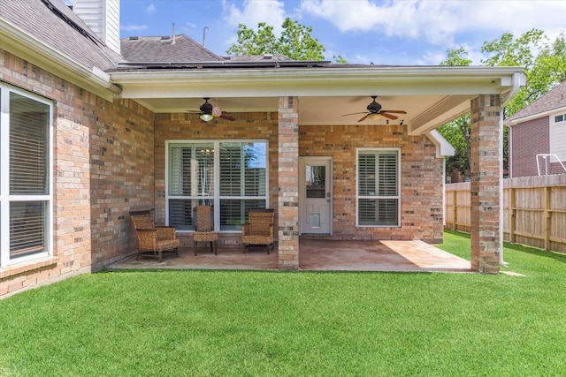 1519 Brookstone Ln, Sugar Land, TX 77479 - doorway to property with ceiling fan, brick siding, a patio, and a shingled roof