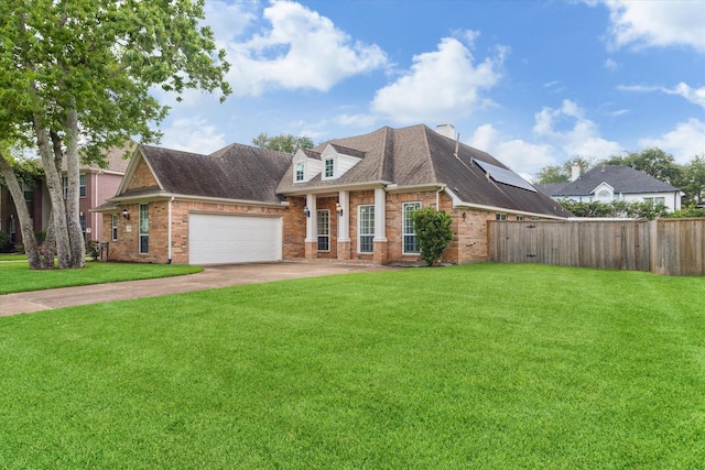 1519 Brookstone Ln, Sugar Land, TX 77479 - view of front of house featuring brick siding, concrete driveway, a garage, a shingled roof, and roof mounted solar panels
