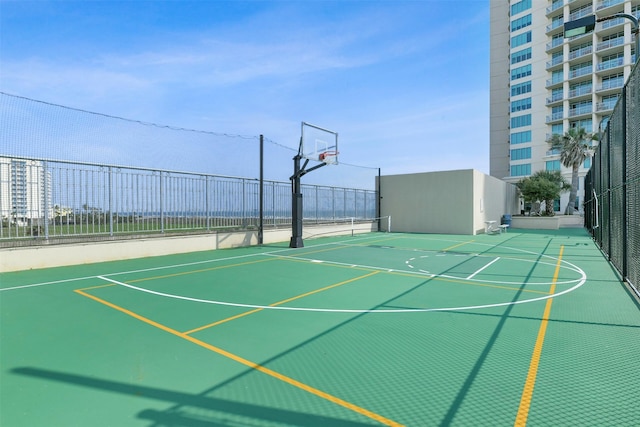 view of basketball court with fence and community basketball court