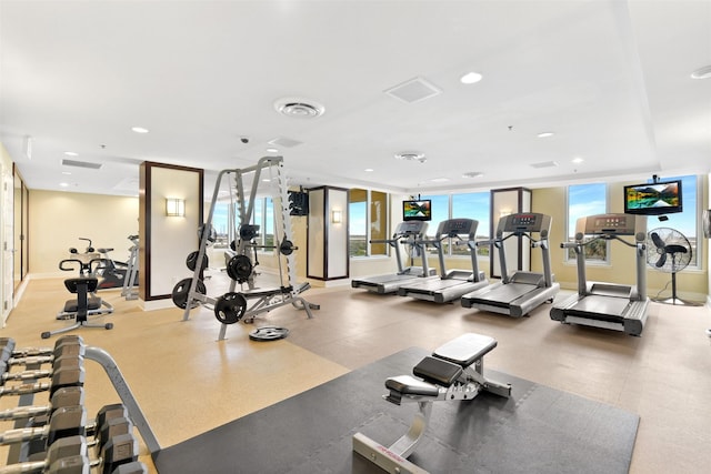 workout area featuring baseboards, recessed lighting, and visible vents
