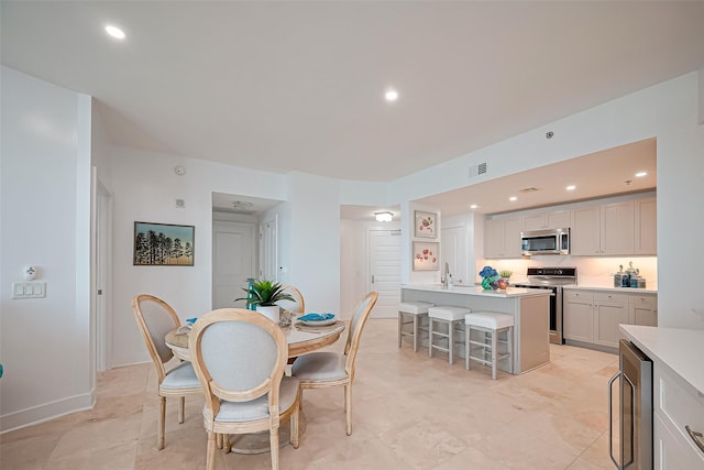 dining area featuring recessed lighting, visible vents, and wine cooler