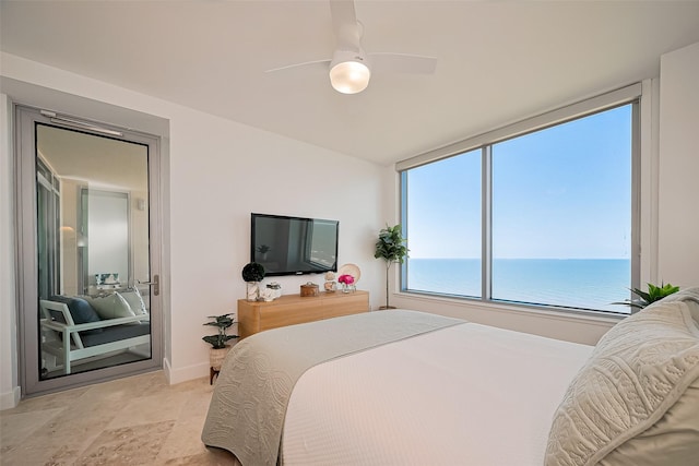 bedroom with a ceiling fan and baseboards