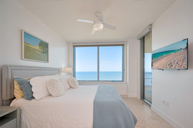 bedroom featuring baseboards, a ceiling fan, multiple windows, and access to exterior