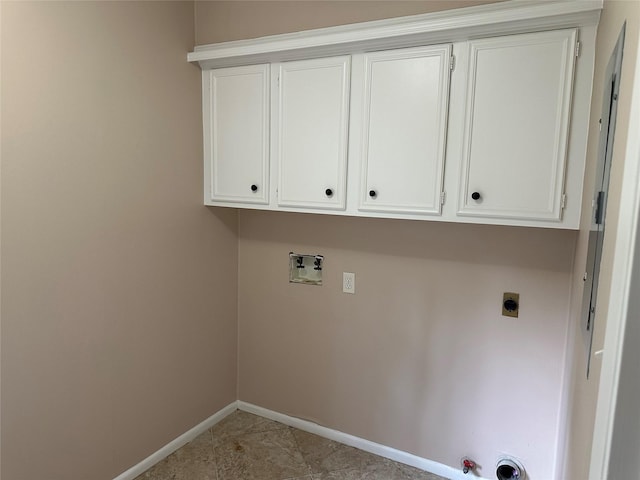 laundry area featuring baseboards, hookup for a washing machine, electric dryer hookup, cabinet space, and hookup for a gas dryer
