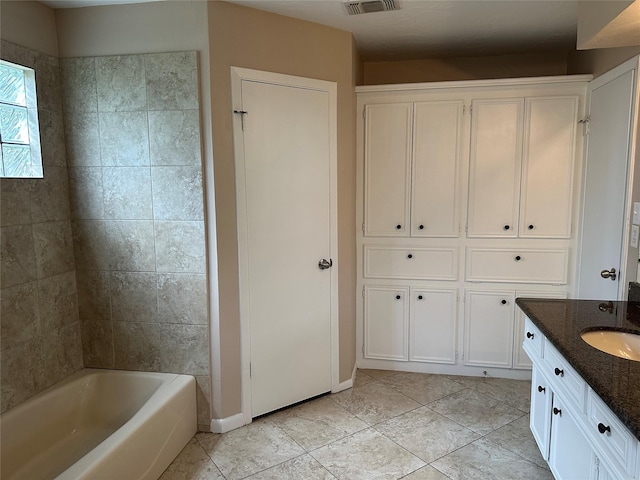 bathroom featuring shower / bath combination, vanity, tile patterned flooring, and visible vents