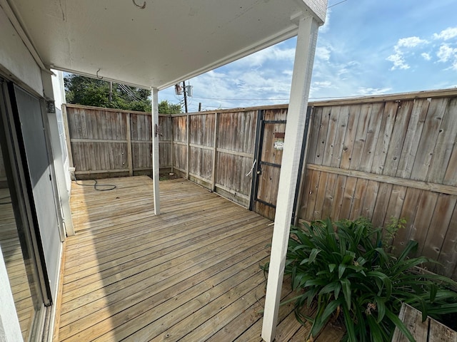 deck with a fenced backyard