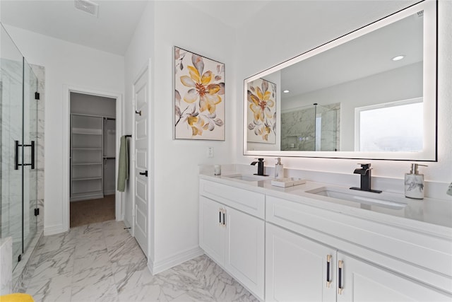 bathroom with a sink, a marble finish shower, visible vents, and marble finish floor