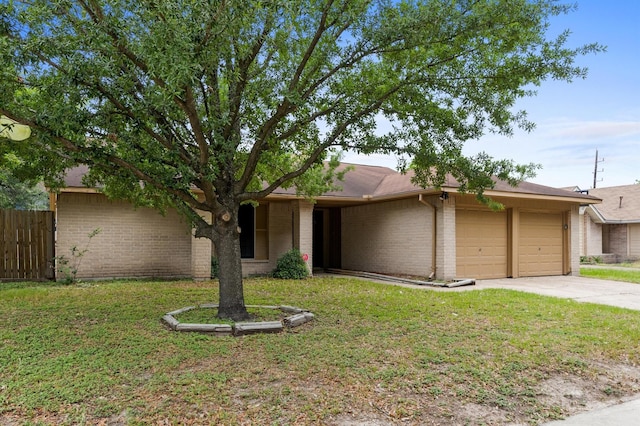 8803 Enchanted Forest Dr, Houston, TX 77088 - single story home featuring an attached garage, fence, brick siding, and concrete driveway