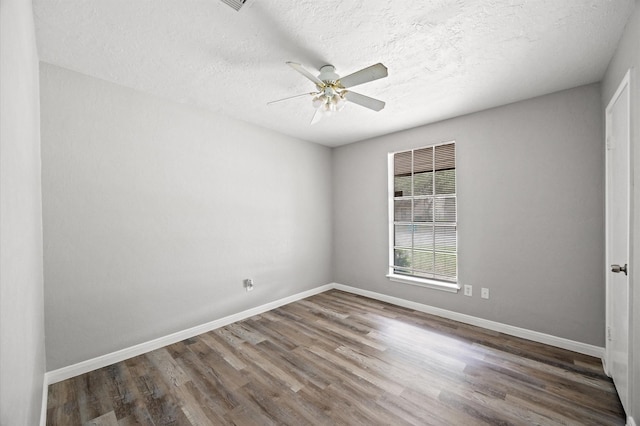 8803 Enchanted Forest Dr, Houston, TX 77088 - empty room featuring baseboards, ceiling fan, and wood finished floors