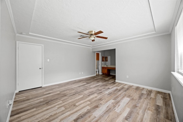 8803 Enchanted Forest Dr, Houston, TX 77088 - unfurnished living room featuring baseboards, a ceiling fan, a textured ceiling, and wood finished floors
