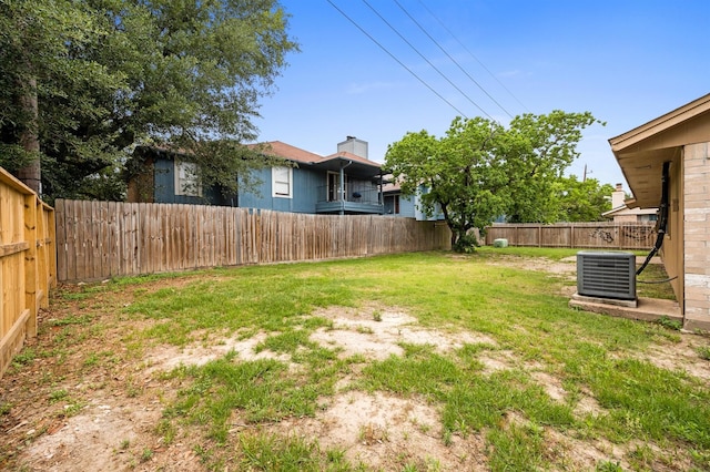 8803 Enchanted Forest Dr, Houston, TX 77088 - view of yard featuring a fenced backyard and central AC