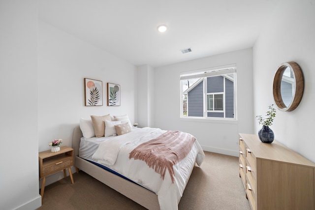 bedroom featuring baseboards, light carpet, recessed lighting, and visible vents