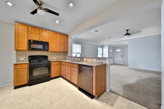 kitchen with a ceiling fan, crown molding, a sink, black appliances, and a peninsula