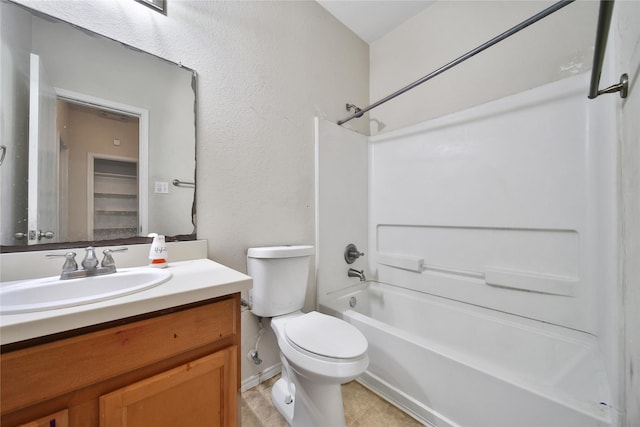 bathroom with vanity,  shower combination, tile patterned floors, and toilet