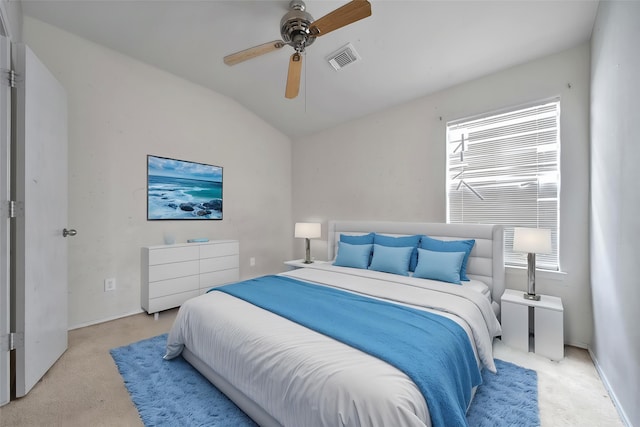 bedroom featuring ceiling fan, carpet floors, baseboards, vaulted ceiling, and visible vents
