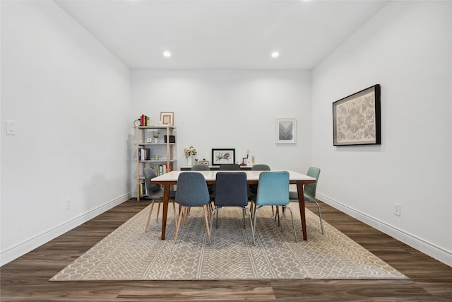 dining room featuring recessed lighting, dark wood-style flooring, and baseboards