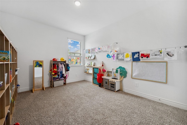 rec room featuring baseboards and carpet flooring