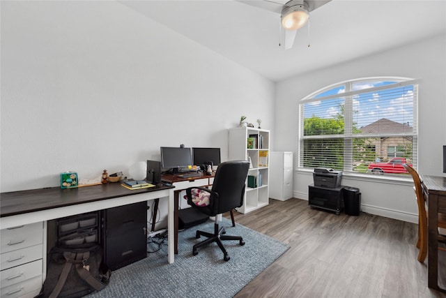 office area featuring baseboards, a ceiling fan, and wood finished floors