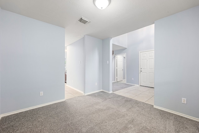 1811 Salt Valley Dr, Katy, TX 77493 - spare room featuring light tile patterned flooring, baseboards, light colored carpet, and visible vents