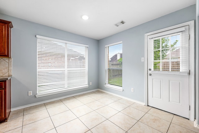 1811 Salt Valley Dr, Katy, TX 77493 - unfurnished dining area featuring visible vents, recessed lighting, baseboards, and light tile patterned floors