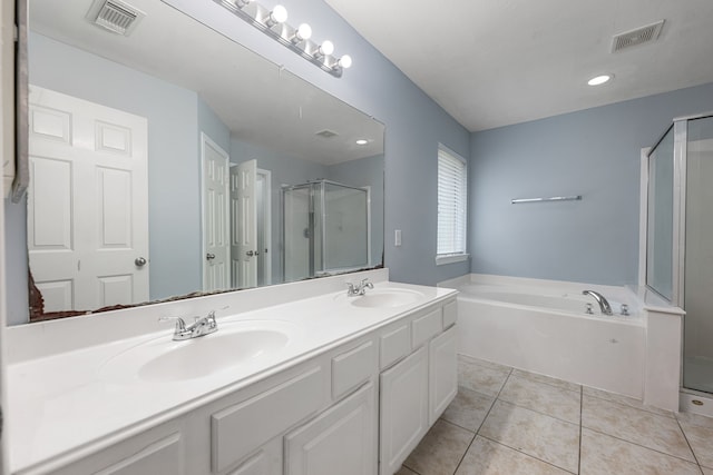 1811 Salt Valley Dr, Katy, TX 77493 - bathroom featuring visible vents, a sink, a garden tub, and a stall shower