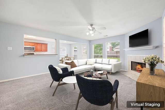 1811 Salt Valley Dr, Katy, TX 77493 - carpeted living room featuring baseboards, ceiling fan, a fireplace, and visible vents