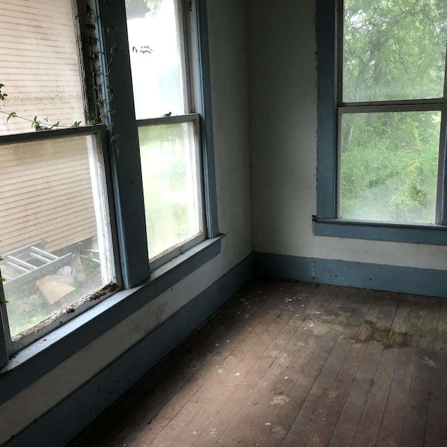 214 E Lee St, Harlingen, TX 78550 - spare room featuring baseboards and hardwood / wood-style floors