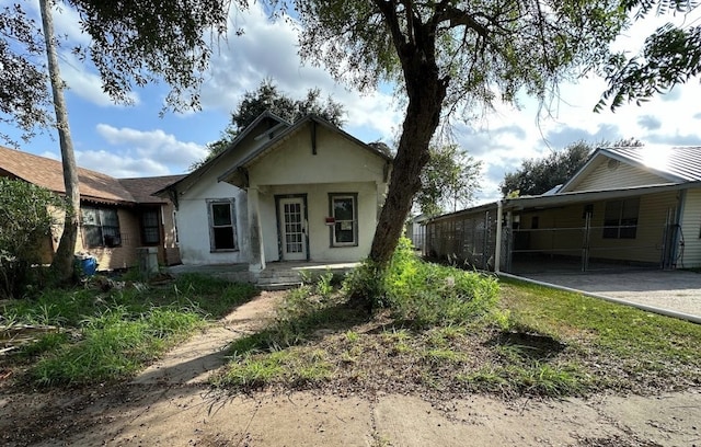 214 E Lee St, Harlingen, TX 78550 - bungalow-style house featuring aphalt driveway and stucco siding
