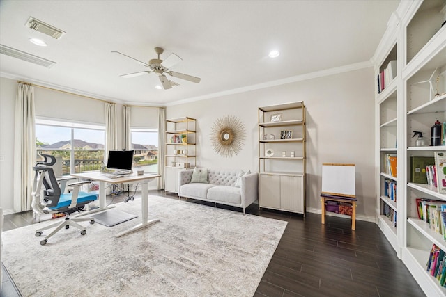 office featuring ornamental molding, a ceiling fan, and visible vents