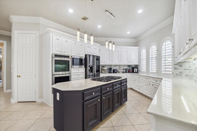 kitchen with visible vents, appliances with stainless steel finishes, tasteful backsplash, light tile patterned floors, and white cabinetry